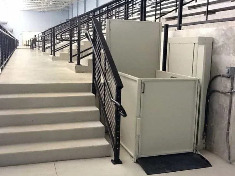 Vertical platform lift used for accessibility at a building entrance
